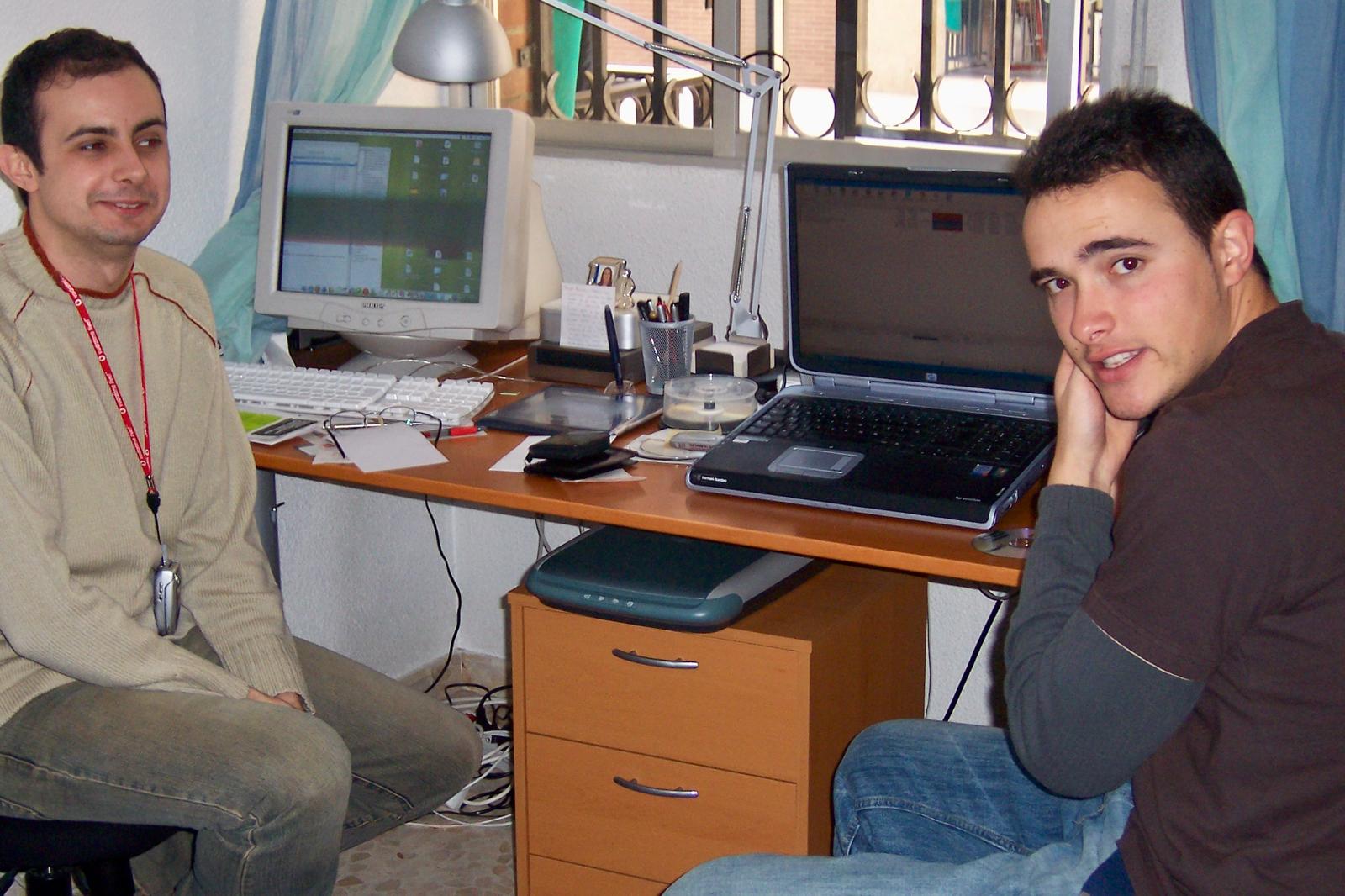 Fran with a friend next to CDs and burners, his first digital projects in Algeciras